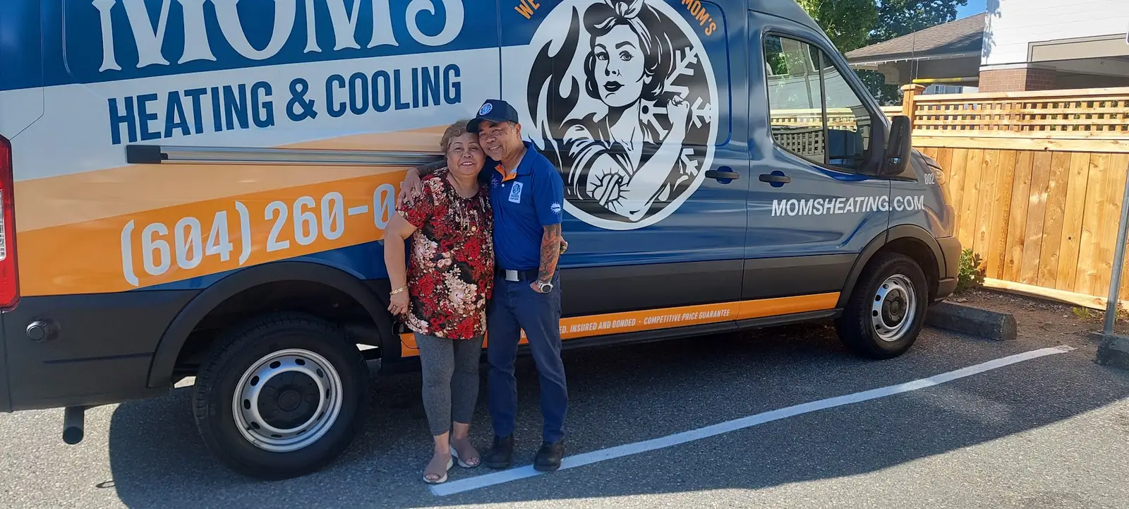 Venice Tabernero with his mother beside a Mom's Heating & Cooling van